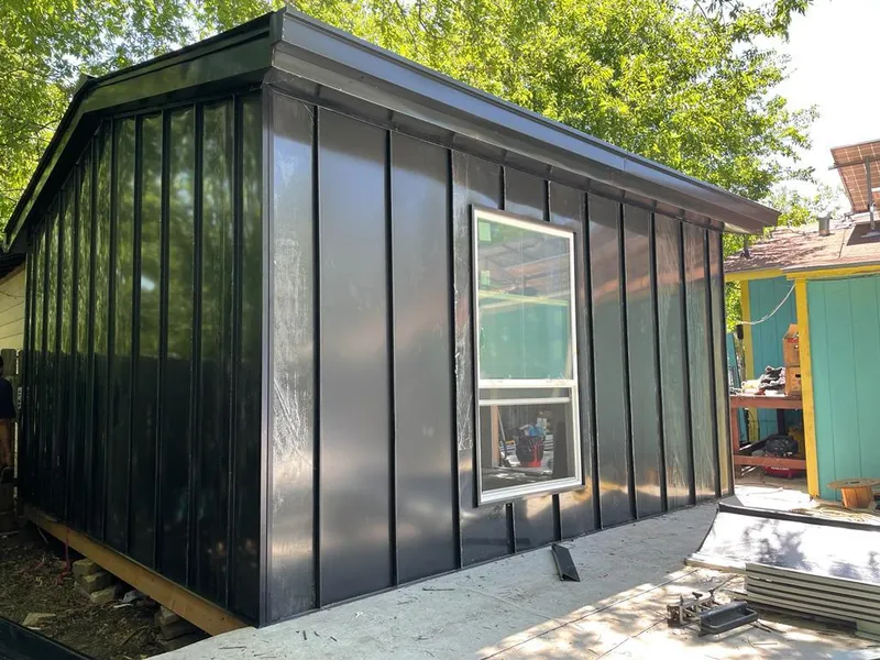 Black standing seam metal wall panels for Roof Inspection in Cheval