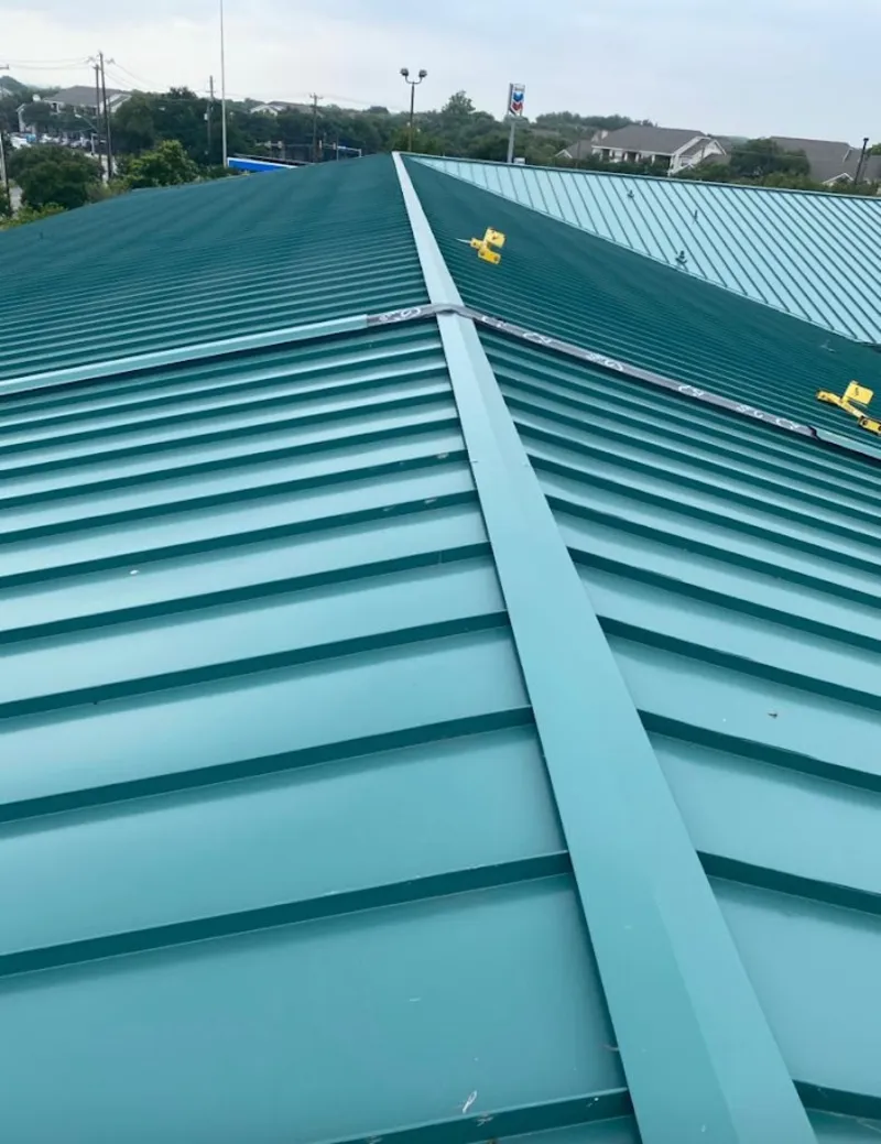 Green commercial metal roof ridge and valley for Metal Roof Repair in Cheval
