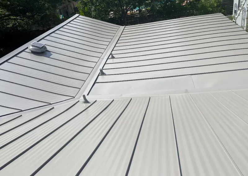 Solar attic fan installed on a metal roof for Roof Ventilation in Cheval
